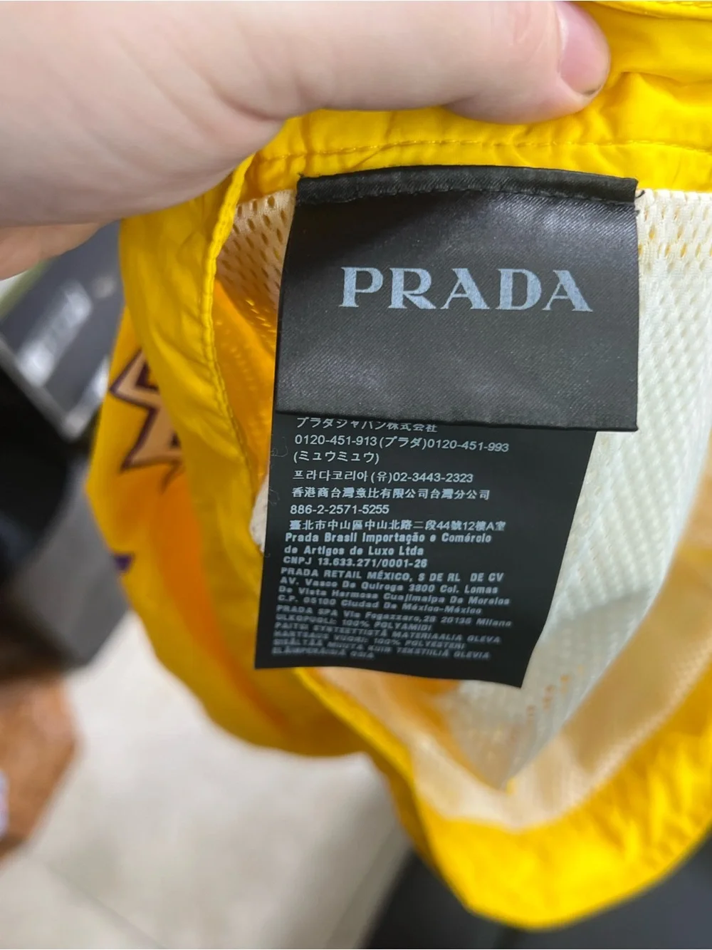 Prada Men’s Yellow Swim Trunks with Purple Lightning Motif